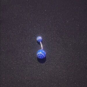 Blue swirly navel piercing.